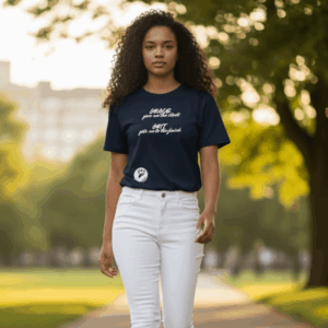 Woman walking outdoors in a black graphic tee and white pants.