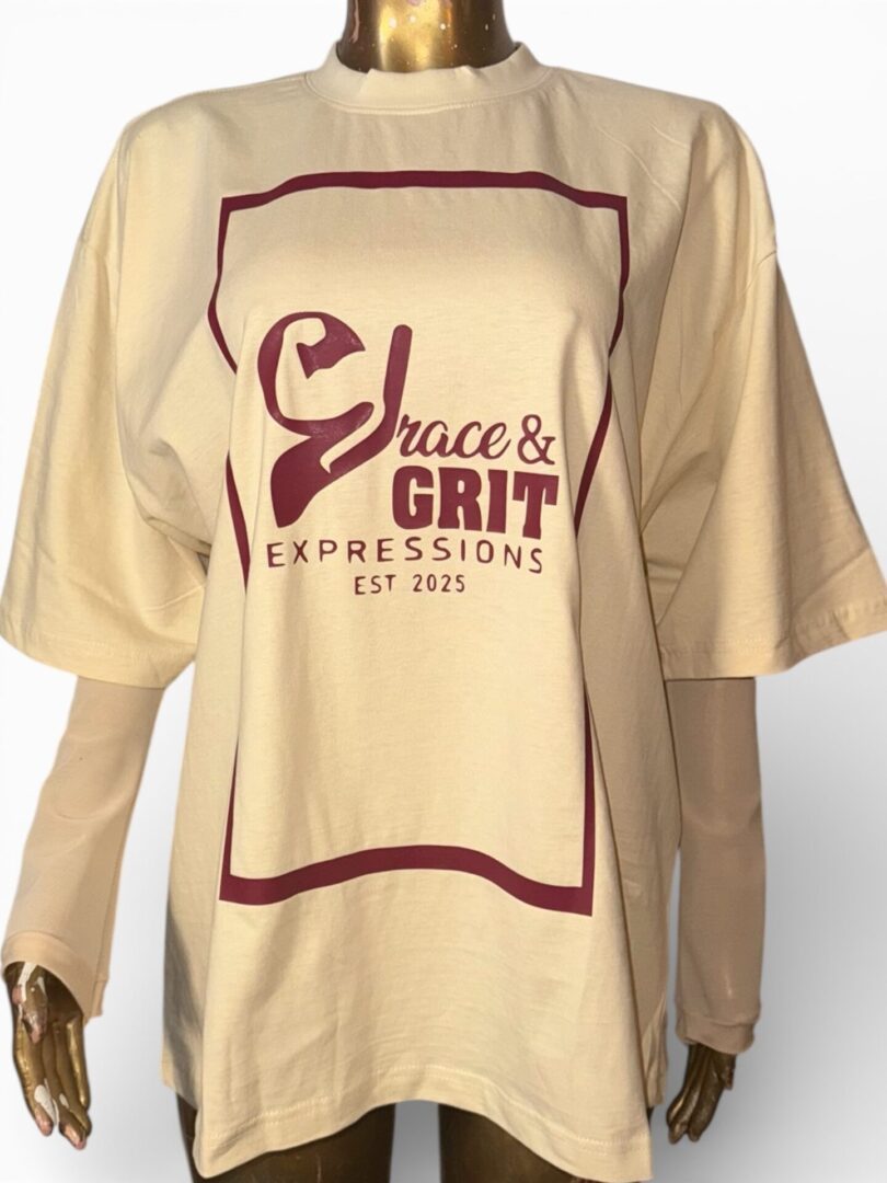 Beige T-shirt with 'Grace & Grit Expressions' logo in burgundy.