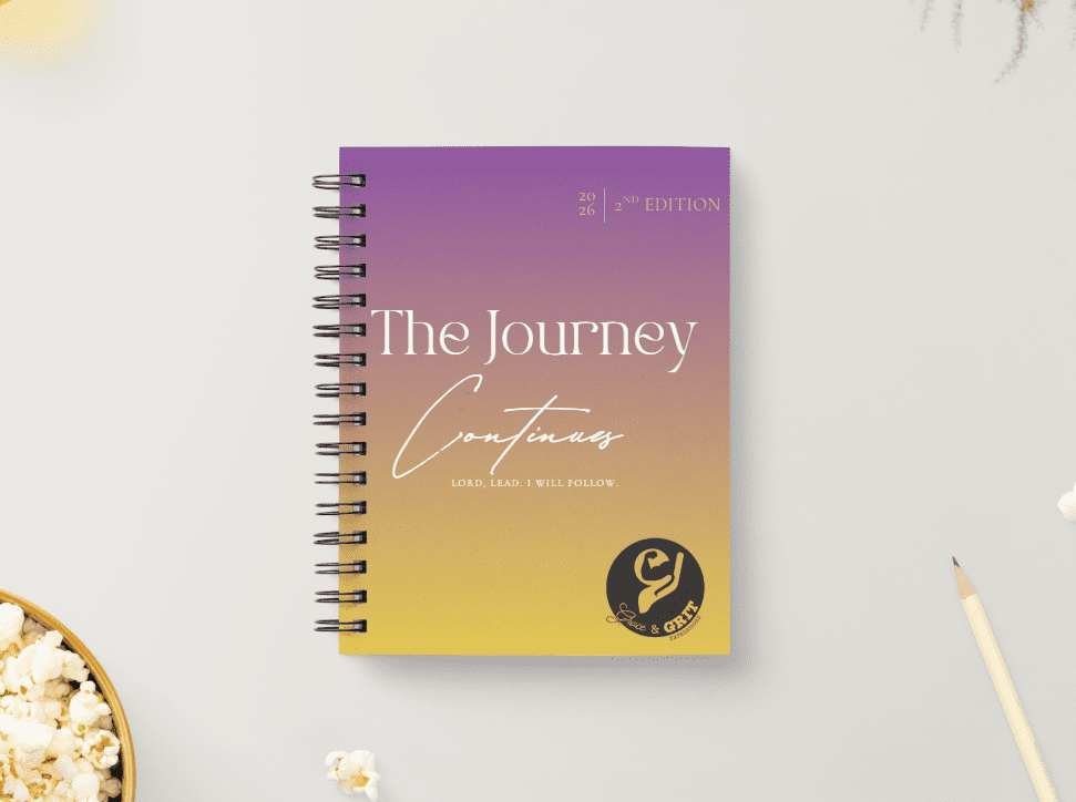 A spiral-bound journal with a purple-to-yellow gradient cover titled 'The Journey Continues'.