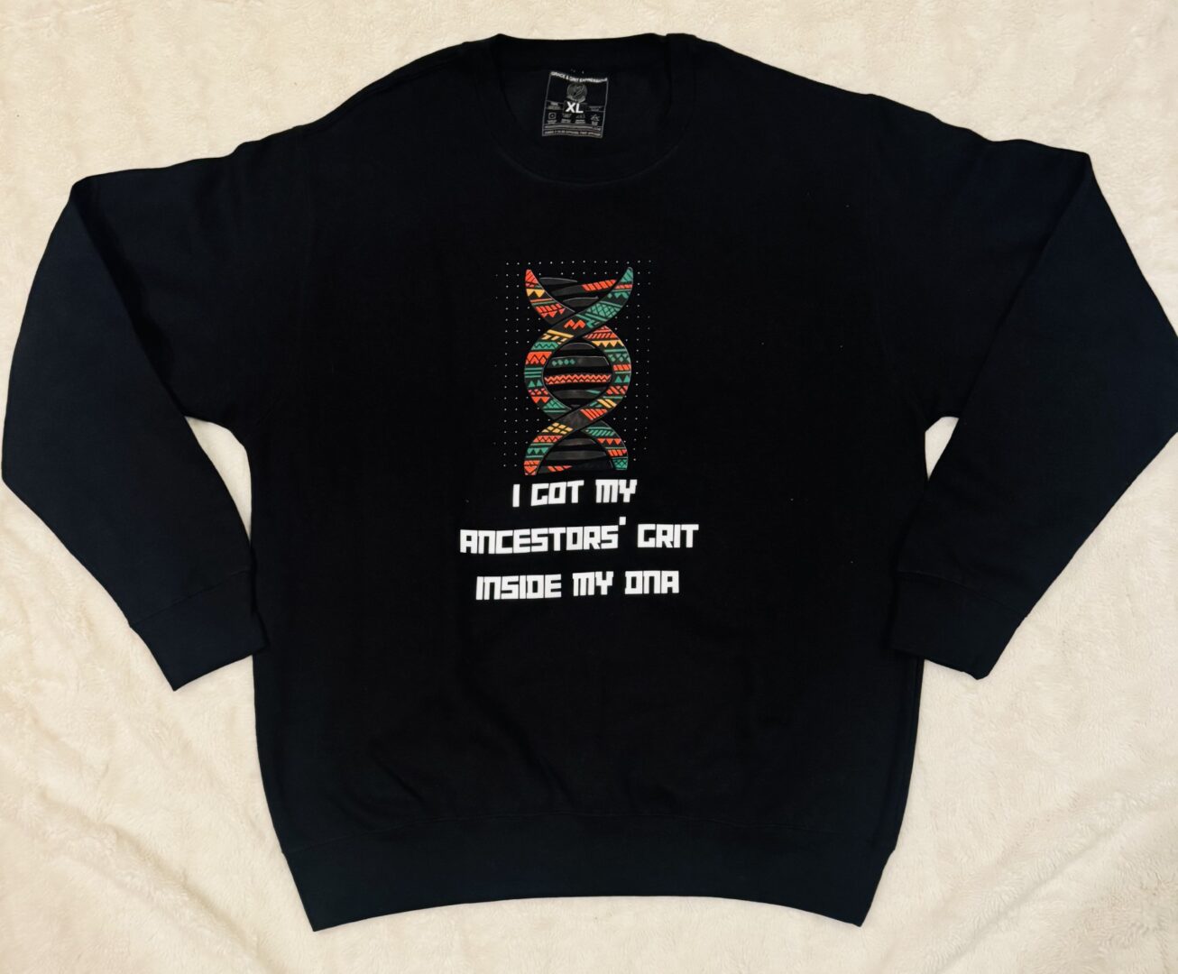Black sweatshirt with a colorful DNA strand and bold text design.