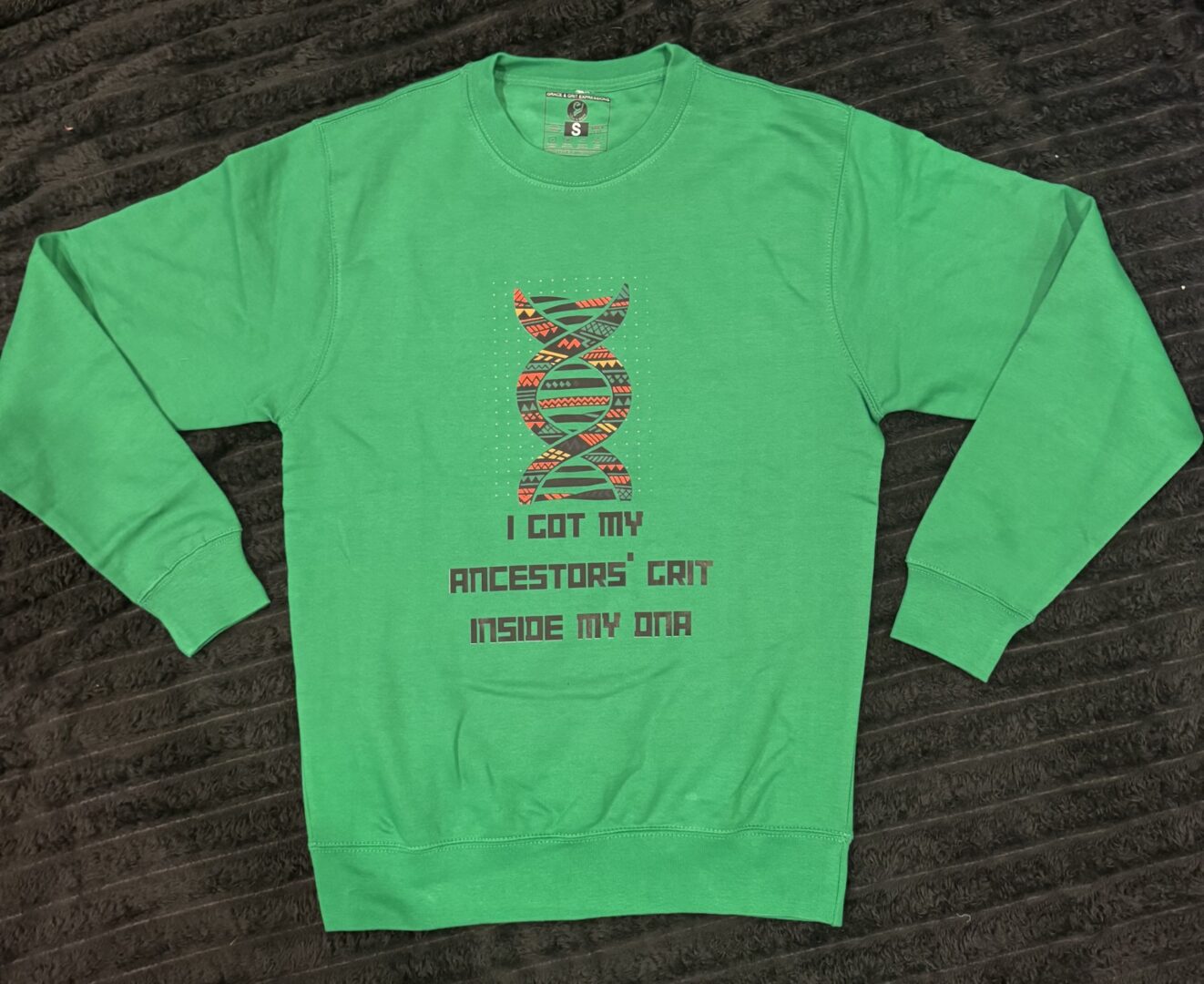 Green sweatshirt with a humorous cactus graphic and text.