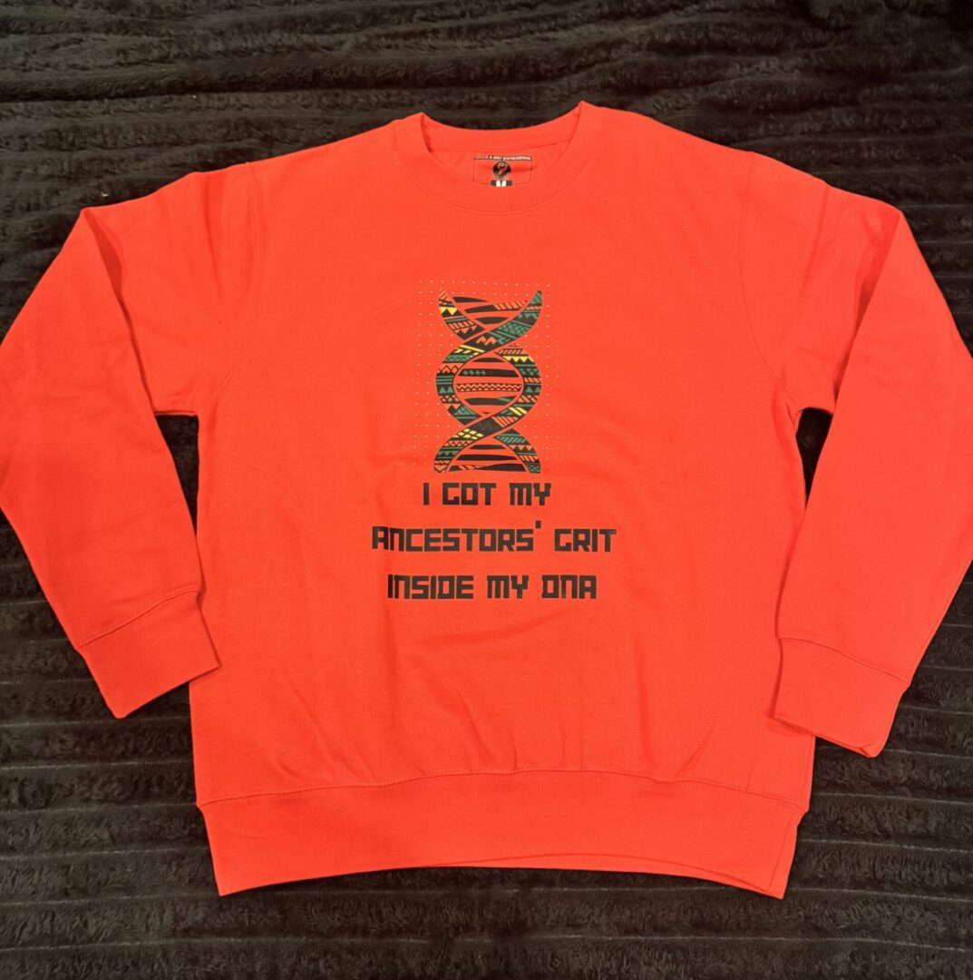 Orange sweatshirt with a motivational fitness quote and a snake graphic.