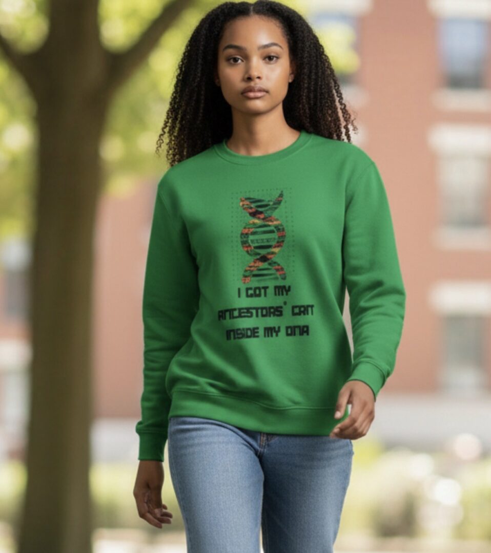 Young woman wearing a green sweatshirt with a motivational graphic design.